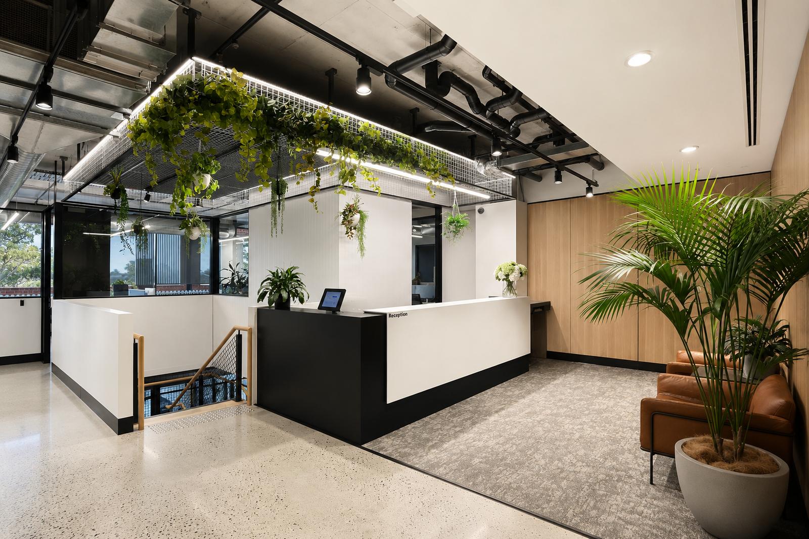 W.hub reception with plant-grid ceiling and leather lounge in Elsternwick